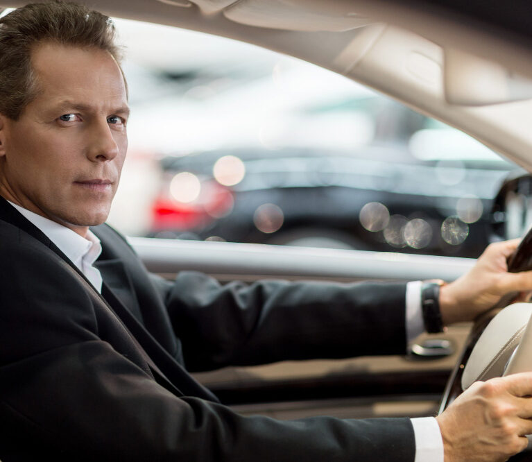 confident-drive-side-view-confident-senior-man-formalwear-sitting-car-looking-camera